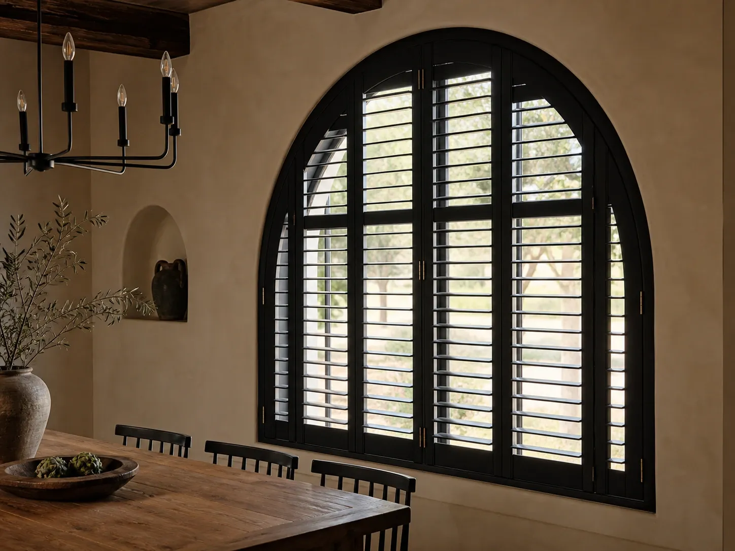 Dark arched custom shutter installation